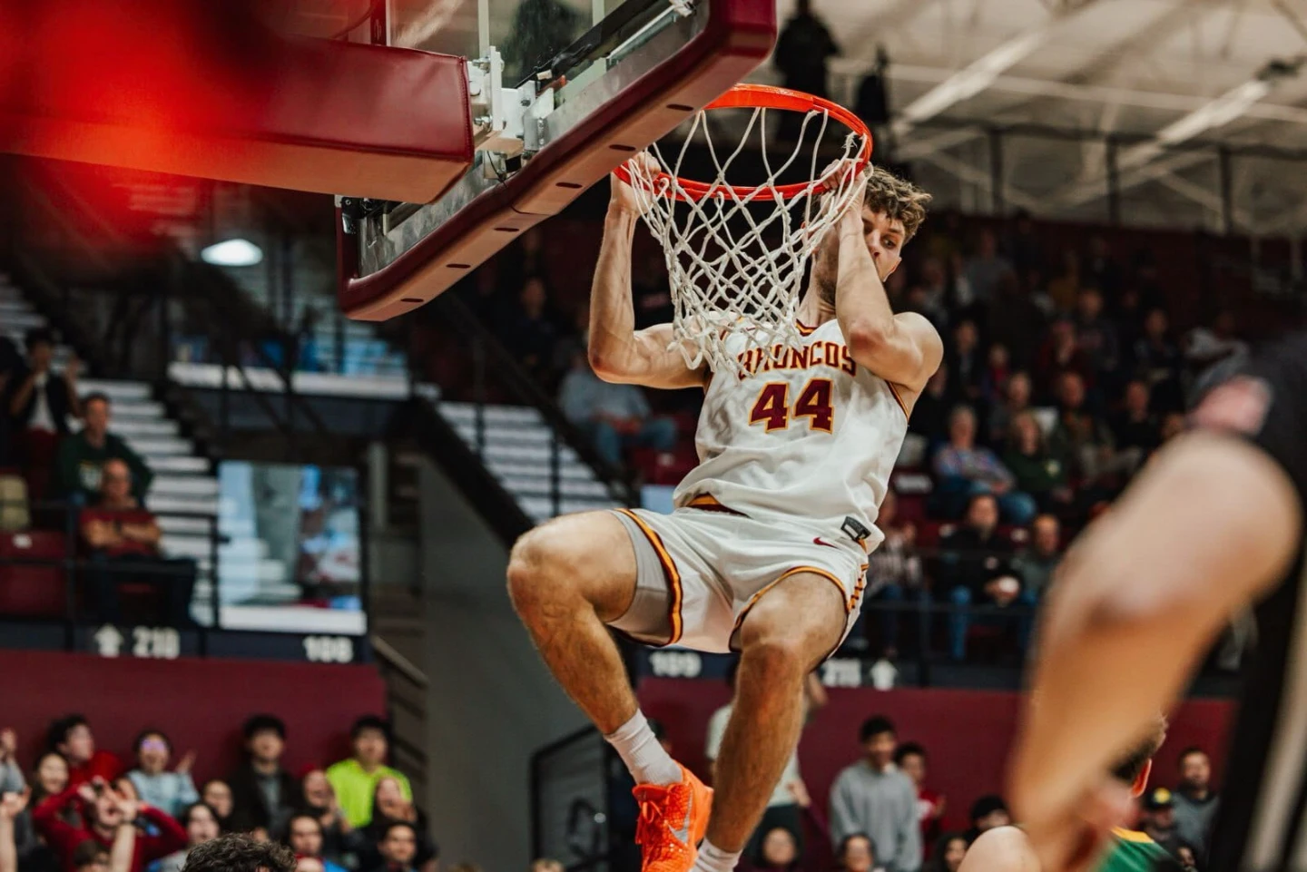 Jake hanging on the rim after a dunk