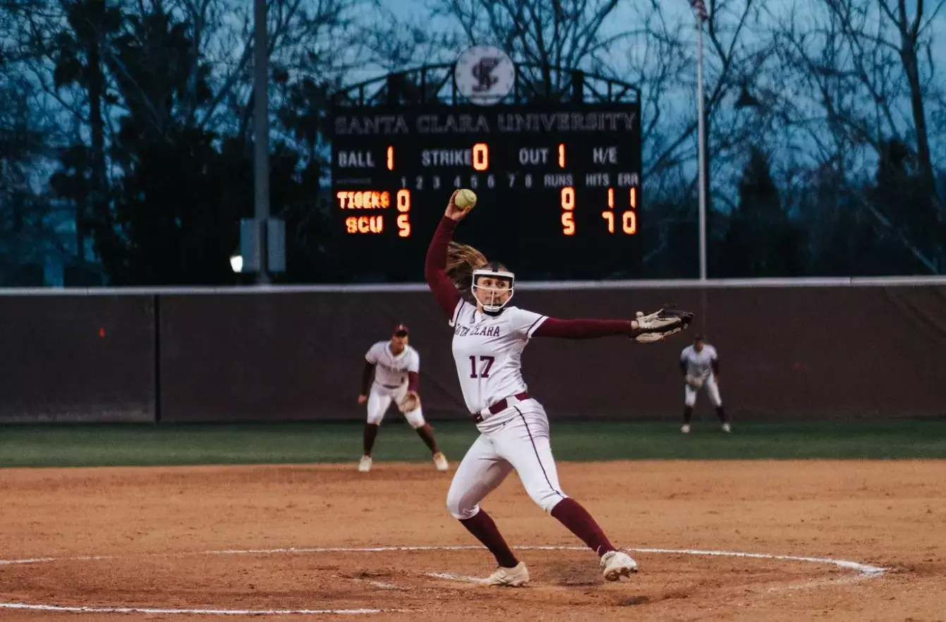 Avery Seva pitching for Santa Clara University at night
