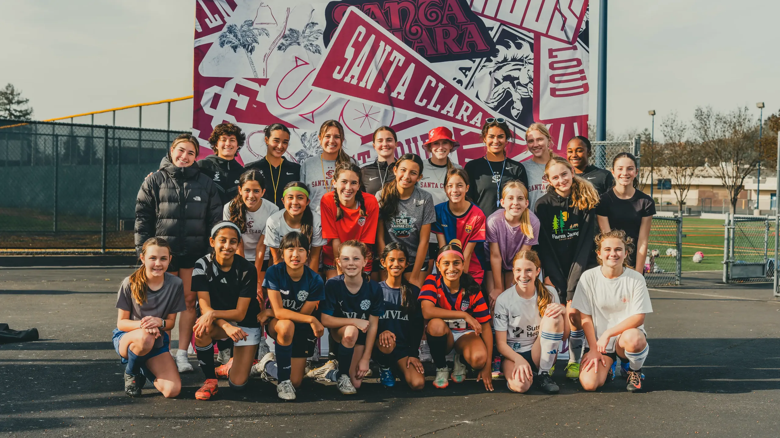 Campers and Santa Clara University players gathered for a group photo