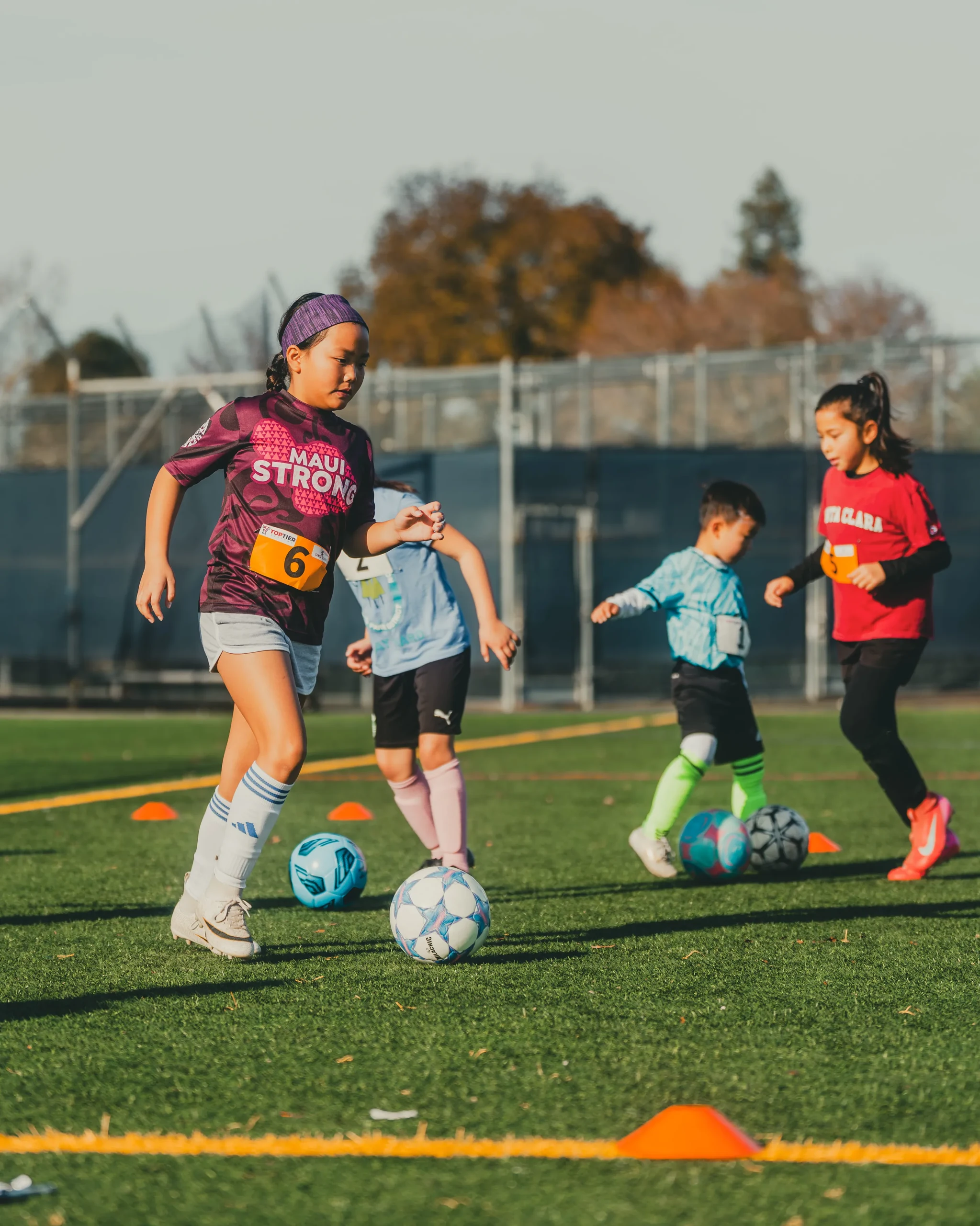 Campers working with the ball during small-group training